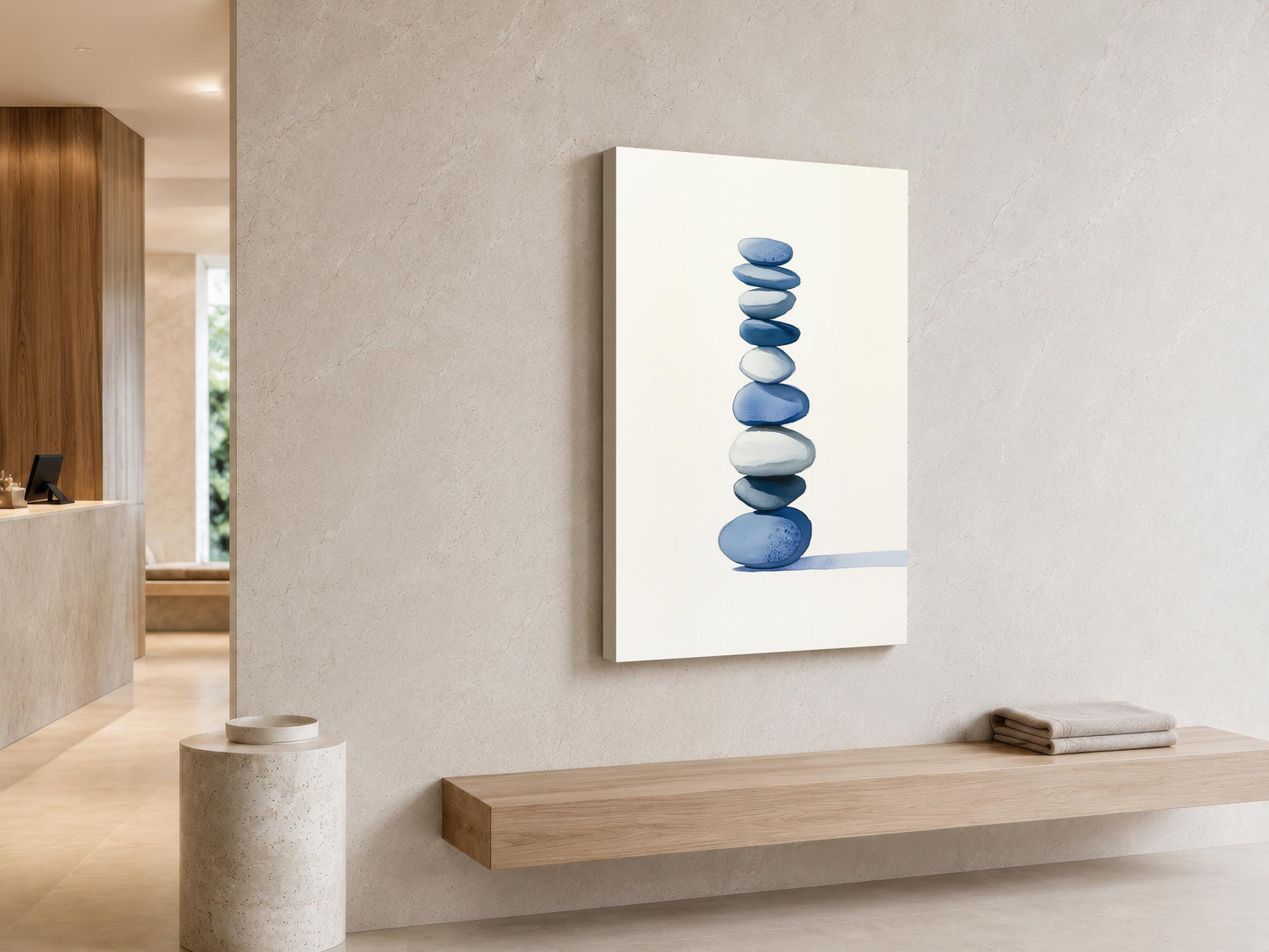 a minimalist interior design with a large white wall art piece depicting a stack of blue and white stones. The art piece is mounted on the wall above a wooden bench, creating a harmonious and balanced composition.