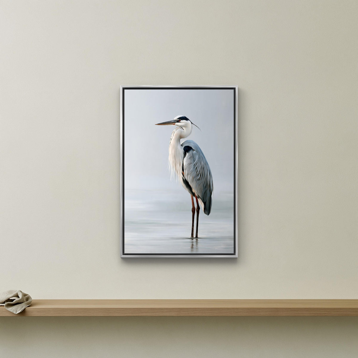 Grey heron in still water canvas wall art, framed photograph of a tall bird, likely a crane or heron, standing on a wooden