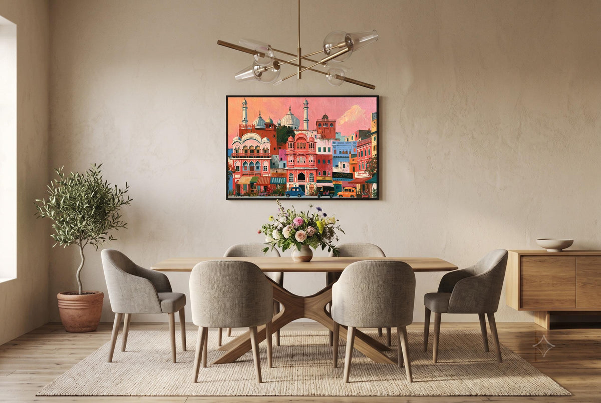 a modern dining room with a wooden table and six matching chairs. Above the table, there is a large framed picture of a cityscape with buildings and a pink sky. The room has a neutral color scheme with beige walls and a wooden floor. A chandelier is hanging from the ceiling, and a potted plant is placed on the floor.