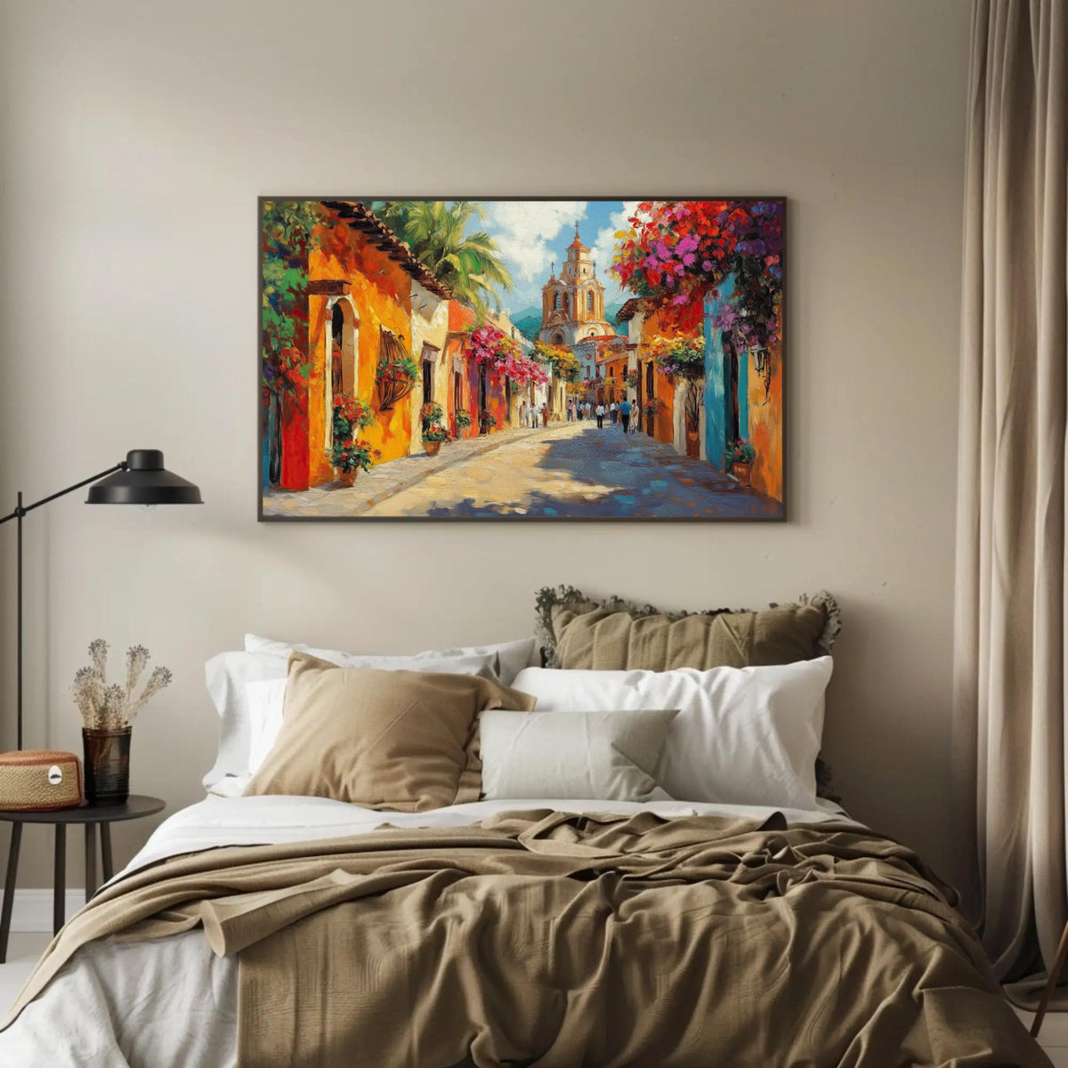 Colorful Mexican street canvas wall art, large, colorful painting of a street scene hanging on a wall above a bed with white