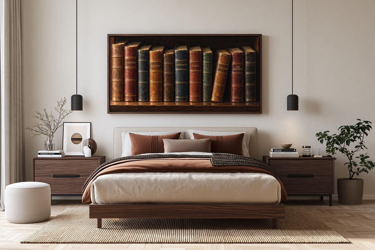 a modern bedroom with a large bed, wooden furniture, and a framed artwork of books on the wall above it.