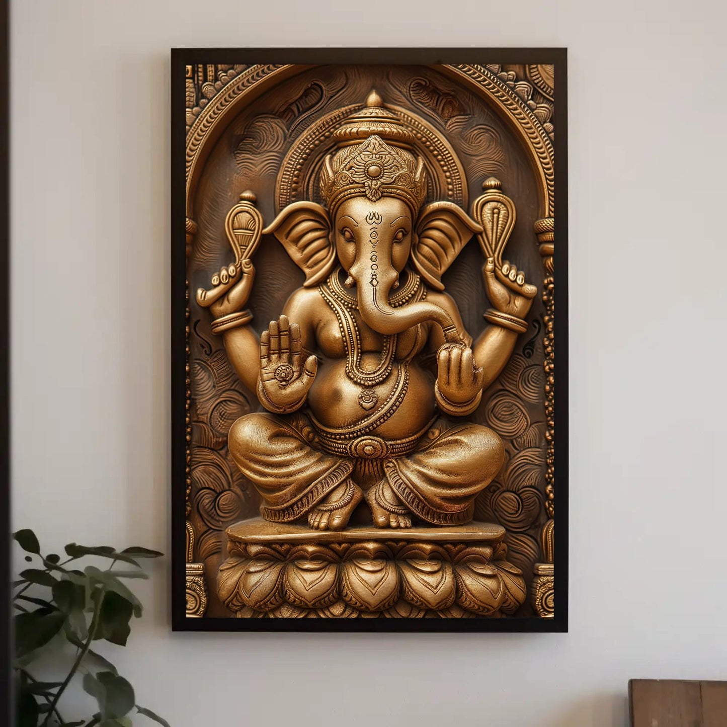 a golden statue of an elephant on a wall