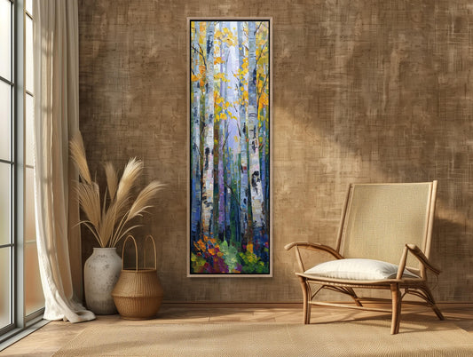 a large painting of a forest scene hanging on a wall in a room with a wooden floor and a beige chair.
