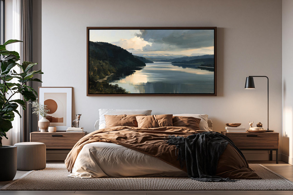 a serene bedroom scene with a large landscape painting hanging above a bed, which is adorned with a brown blanket and a black throw. The room features a wooden nightstand with a lamp, a plant, and a vase, creating a cozy and inviting atmosphere.