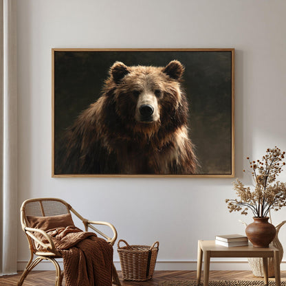 a large brown bear in a dark background, hanging on a wall as a framed artwork.