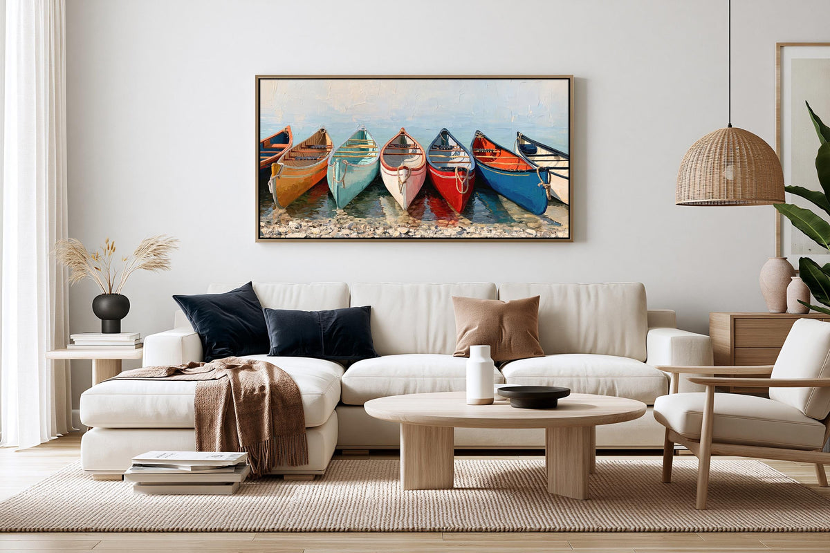 a cozy living room with a large painting of colorful canoes hanging on the wall above a white sofa.
