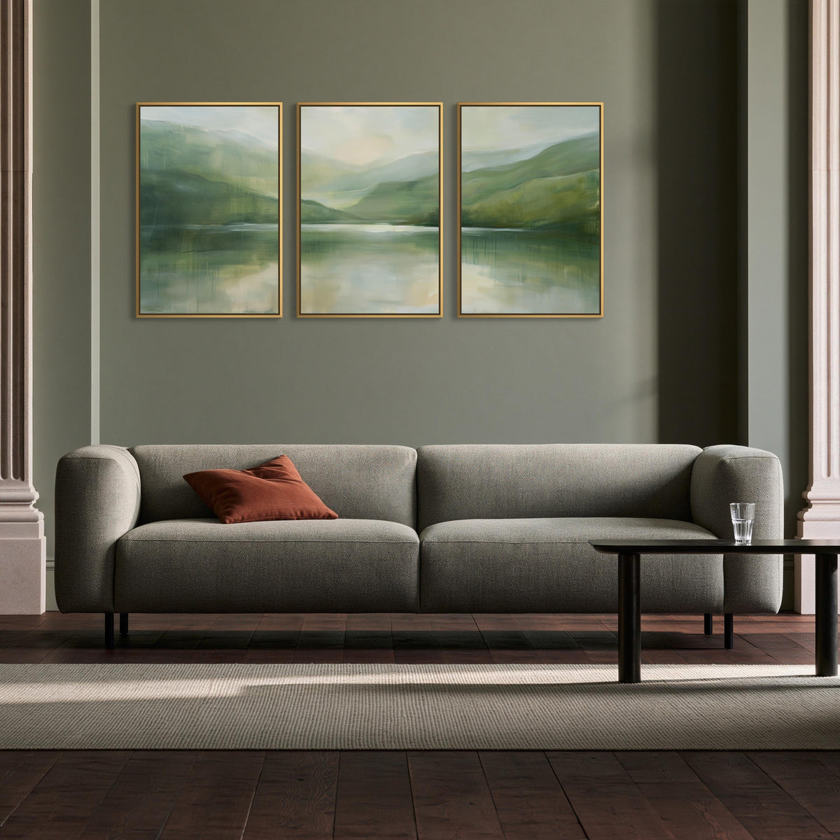 Misty sage lake triptych canvas wall art, modern living room with a gray sofa, a wooden coffee table, and a large painting