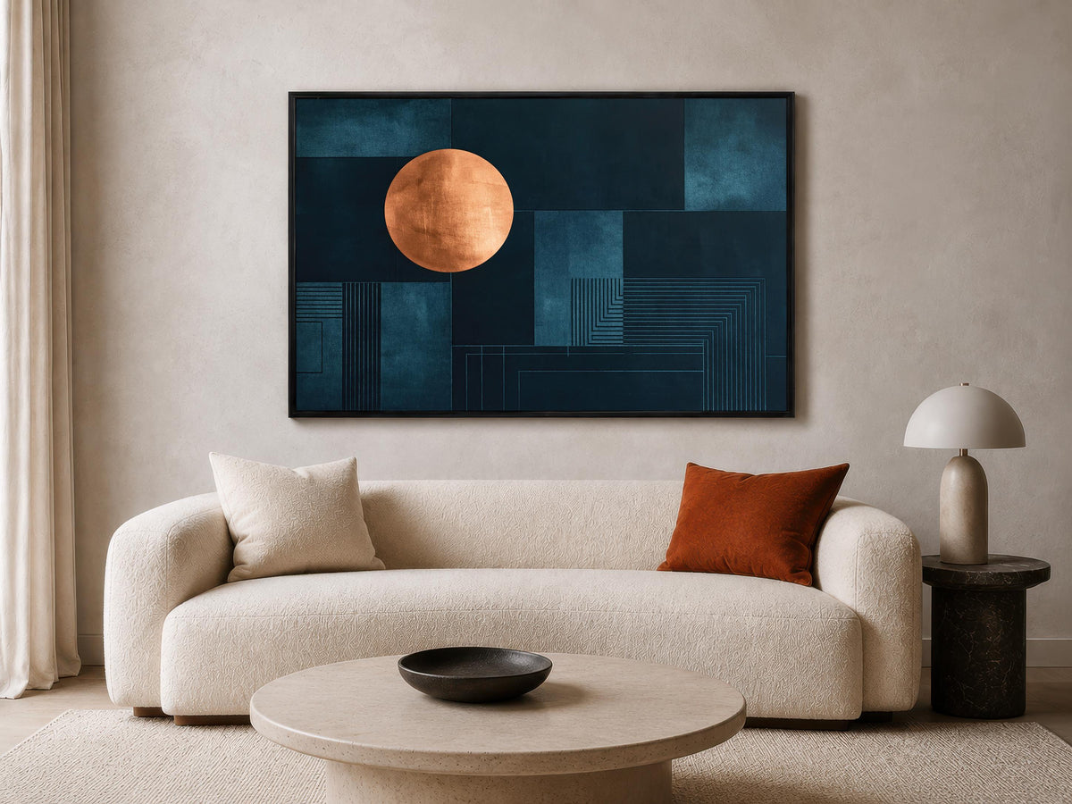 a modern living room with a large abstract painting hanging on the wall above a white sofa. The painting has a blue background with a large orange circle in the center. The room also includes a round coffee table with a black bowl on it, and a side table with a lamp.