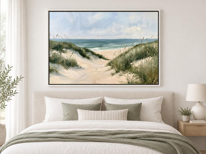 a large painting of a beach scene hanging on a wall above a bed with white bedding and pillows.