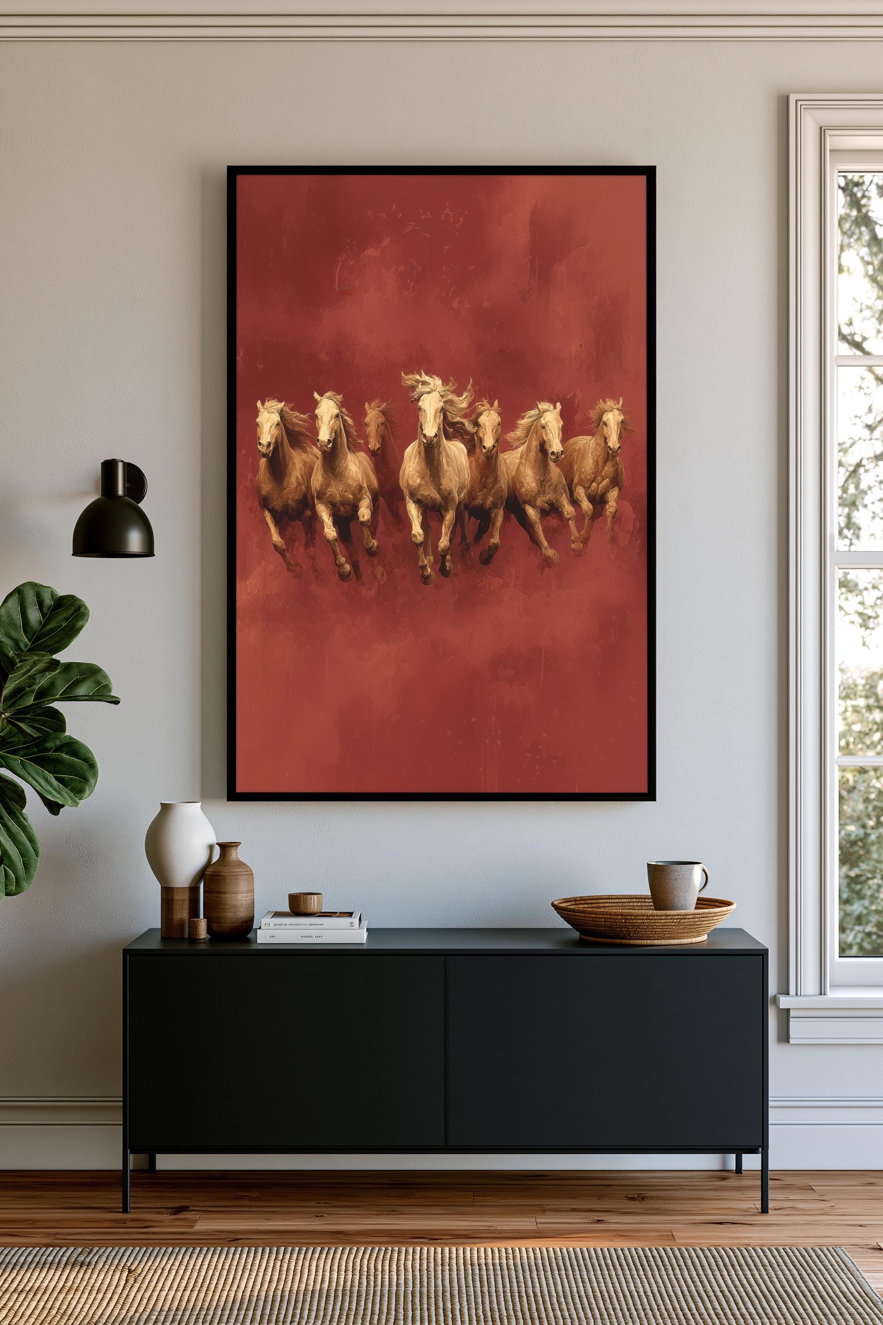 a large framed painting of five galloping horses on a red background, hanging on a wall above a black console table.