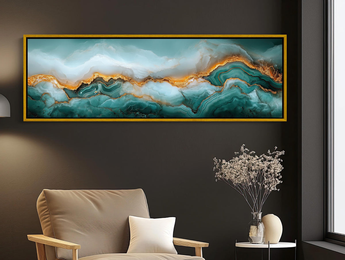 Teal and gold agate canvas wall art, large abstract painting hanging on a wall above a beige armchair in a living room