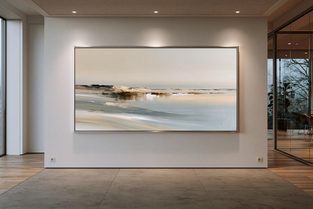 a large, framed painting of a serene landscape, hanging on a white wall in a modern, minimalist room.
