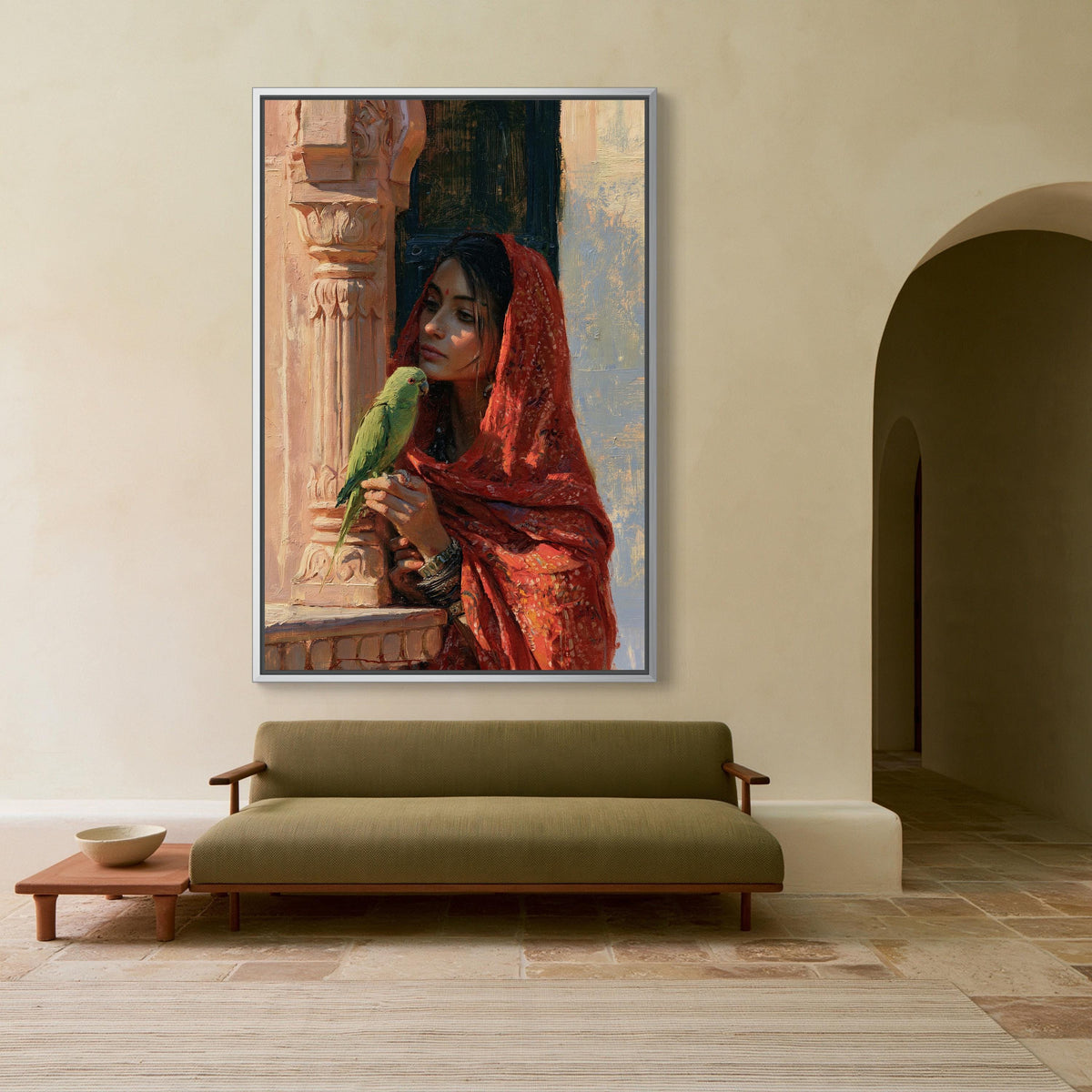 Rajasthani woman with parakeet canvas wall art, large painting of a woman in a red shawl, holding a green parrot, hanging on