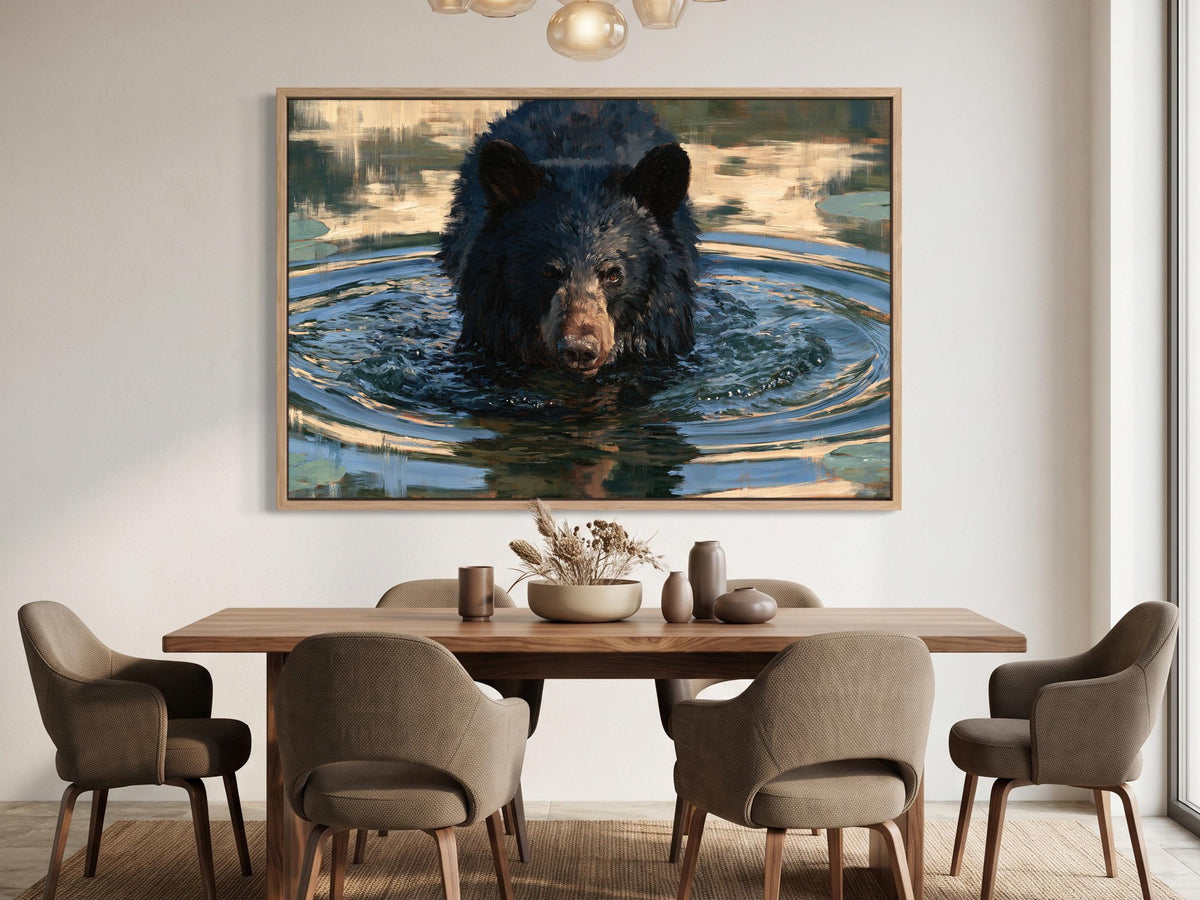 a large black bear swimming in a body of water, with a wooden dining table and chairs in the foreground.