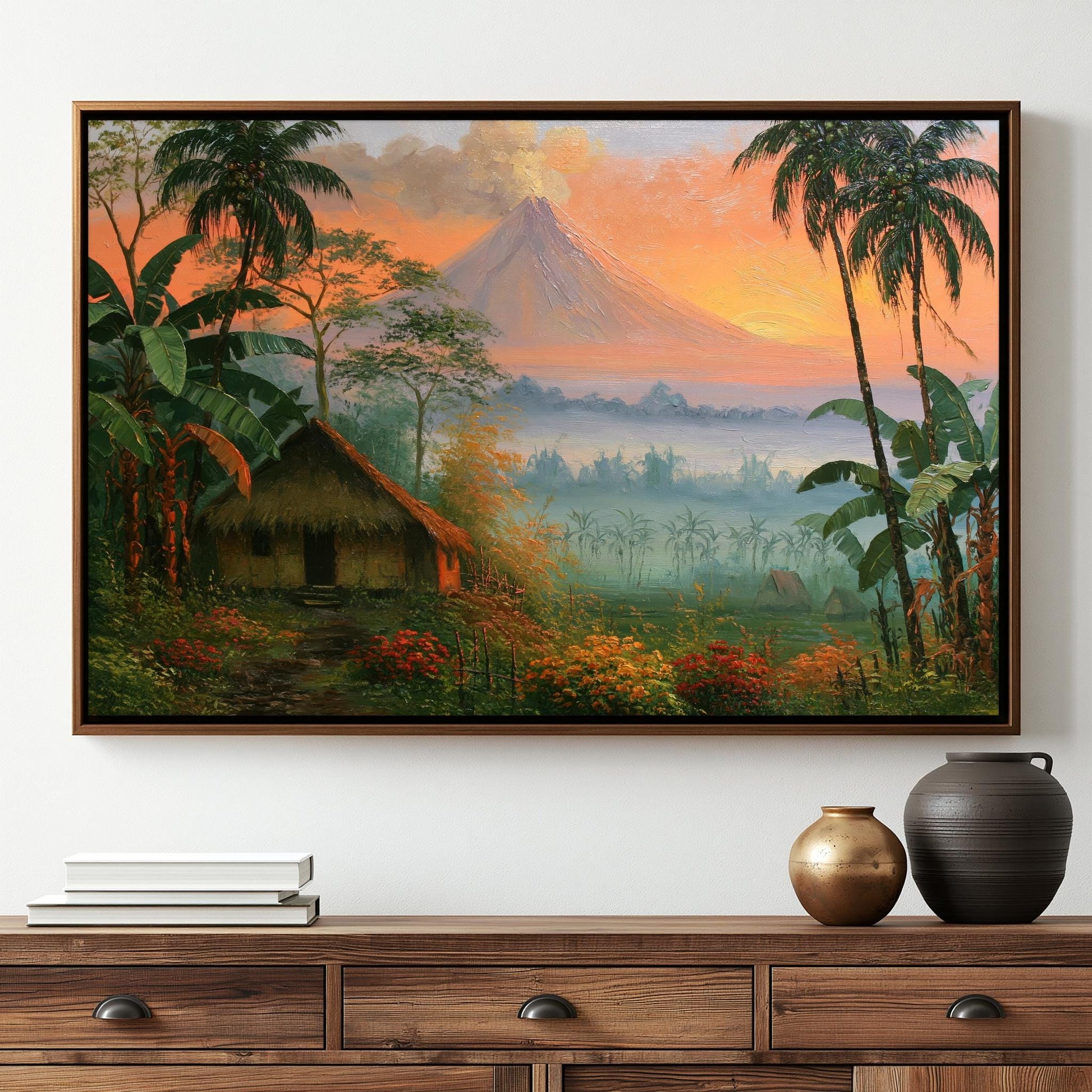 The image is a framed painting depicting a tropical landscape with a large mountain in the background, surrounded by lush vegetation, palm trees, and a hut.