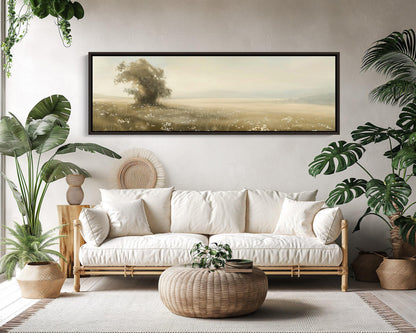 Lone tree vintage meadow canvas wall art, living room with a couch, potted plants and a painting on the wall