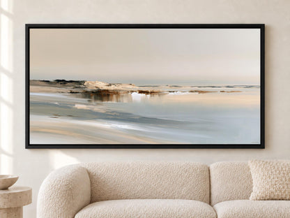 a large, framed painting of a serene landscape depicting a beach with a calm body of water in the background.