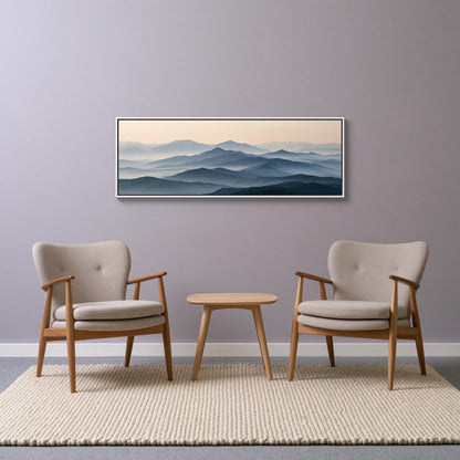 Blue grey mountain ridges canvas wall art, minimalist living room setting with two beige armchairs and a small wooden table
