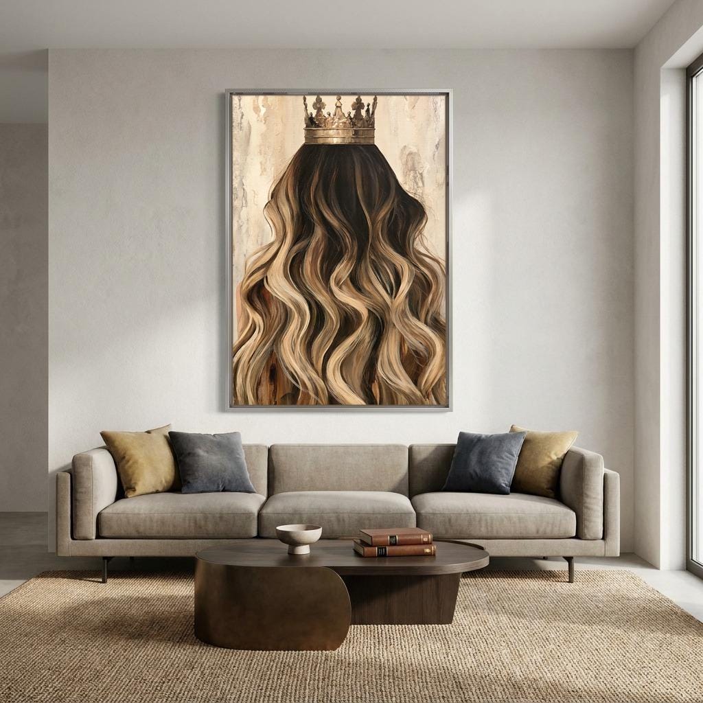 a large painting of a woman's long, wavy hair with a crown on her head, hanging on a wall above a gray sofa with two throw pillows.