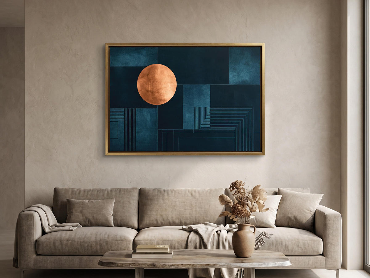 a modern living room with a large abstract painting hanging on the wall above a beige sofa. The painting has a blue background with a large orange circle in the center. The sofa is positioned in front of the painting, and there is a wooden coffee table in front of it. A vase with flowers is also present on the coffee table.