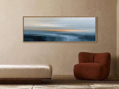 Navy orange abstract seascape canvas wall art, large painting of a serene landscape hanging on a beige wall above a brown