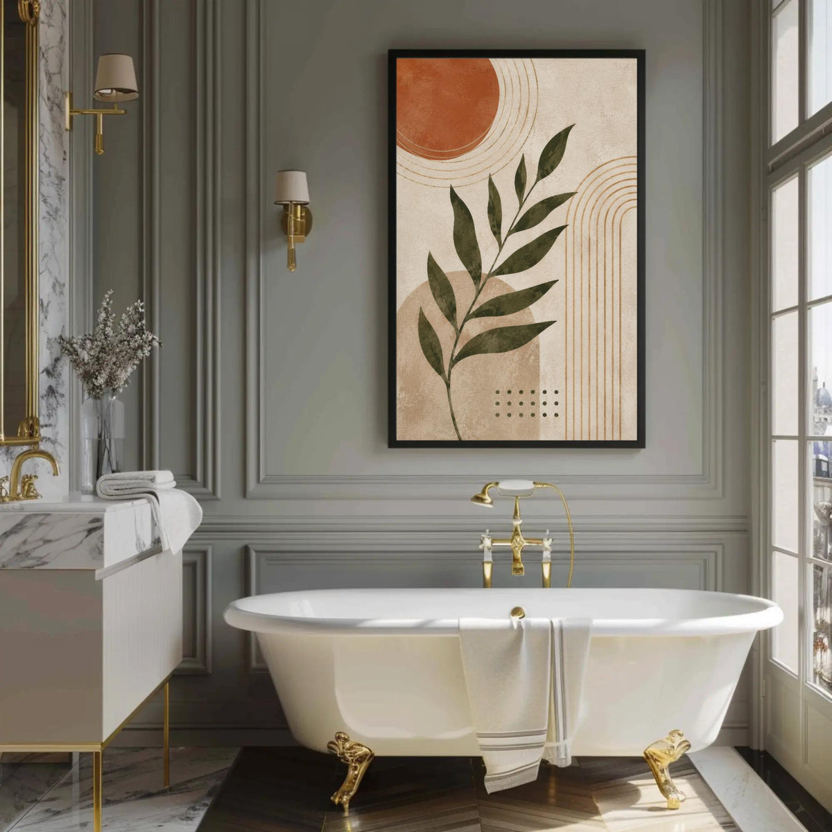 a luxurious bathroom with a large white freestanding bathtub, a marble vanity, and a framed abstract artwork featuring a leaf design.