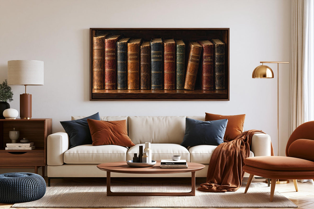 a cozy living room with a white sofa, a wooden coffee table, and a bookshelf filled with books. The bookshelf has a large framed picture of books on the wall above it.