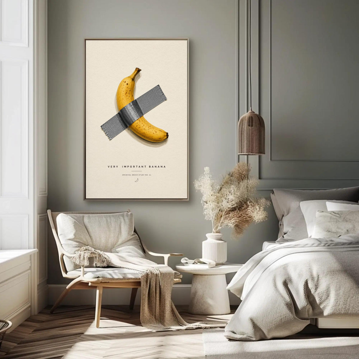 a bedroom with a bed, a chair, a table, and a poster of a banana taped to the wall.