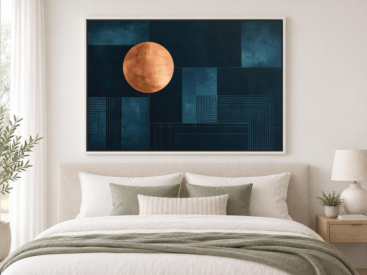 a large abstract painting hanging on a wall above a bed with white pillows and a gray blanket.