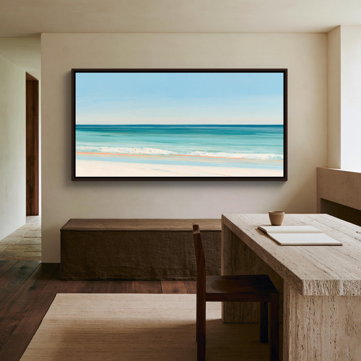 Turquoise ocean beach canvas wall art, serene beach scene with a large framed painting hanging on the wall above a wooden