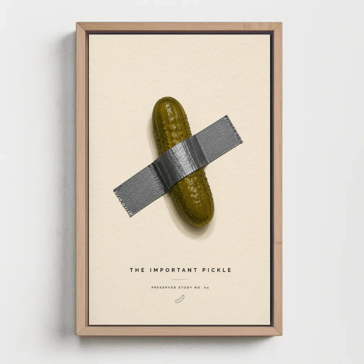 Taped pickle canvas wall art, single object, a pickle, which is taped to a wall