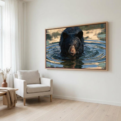 a large black bear swimming in a body of water, with a framed painting of the bear hanging on the wall above a white armchair in a living room setting.