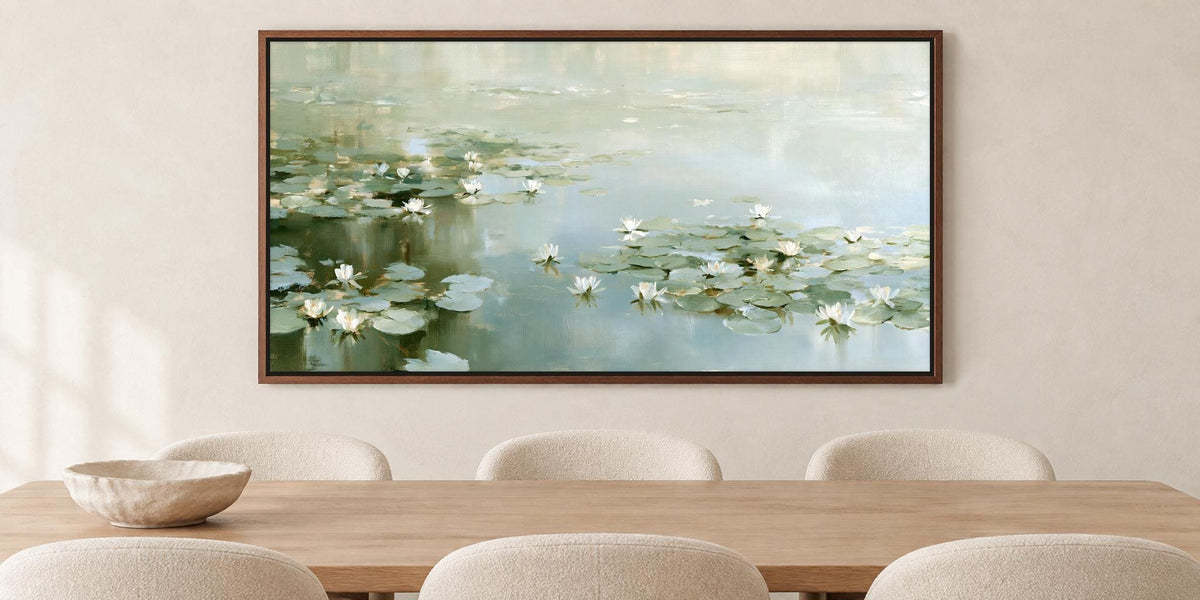 a large painting of water lilies hanging on a wall above a wooden dining table with four chairs.