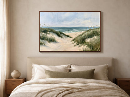 a serene beach scene with sand dunes and grassy areas, featuring a calm ocean in the background.