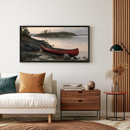 a cozy living room with a white sofa, a wooden side table, and a framed picture of a red canoe on a rocky shore.