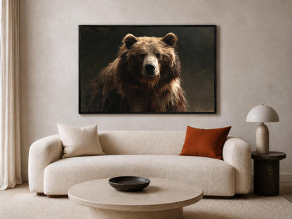a large brown bear in a dark background, mounted on a wall above a white sofa with a round coffee table in front of it.