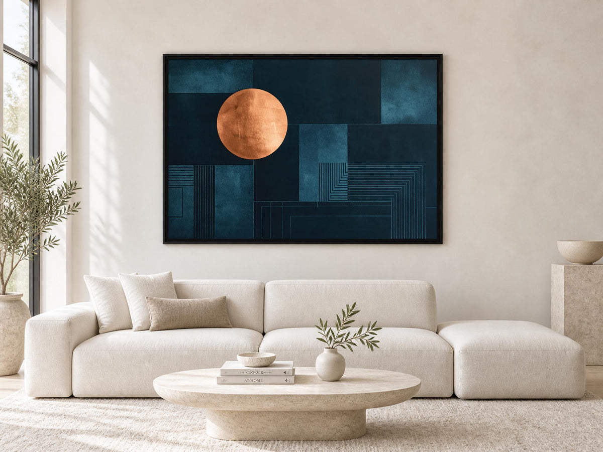 a modern living room with a large abstract painting hanging on the wall above a white sofa. The painting has a dark blue background with a large orange circle in the center. The room is decorated with a potted plant, a vase with greenery, and a round coffee table with a bowl and a book on it.