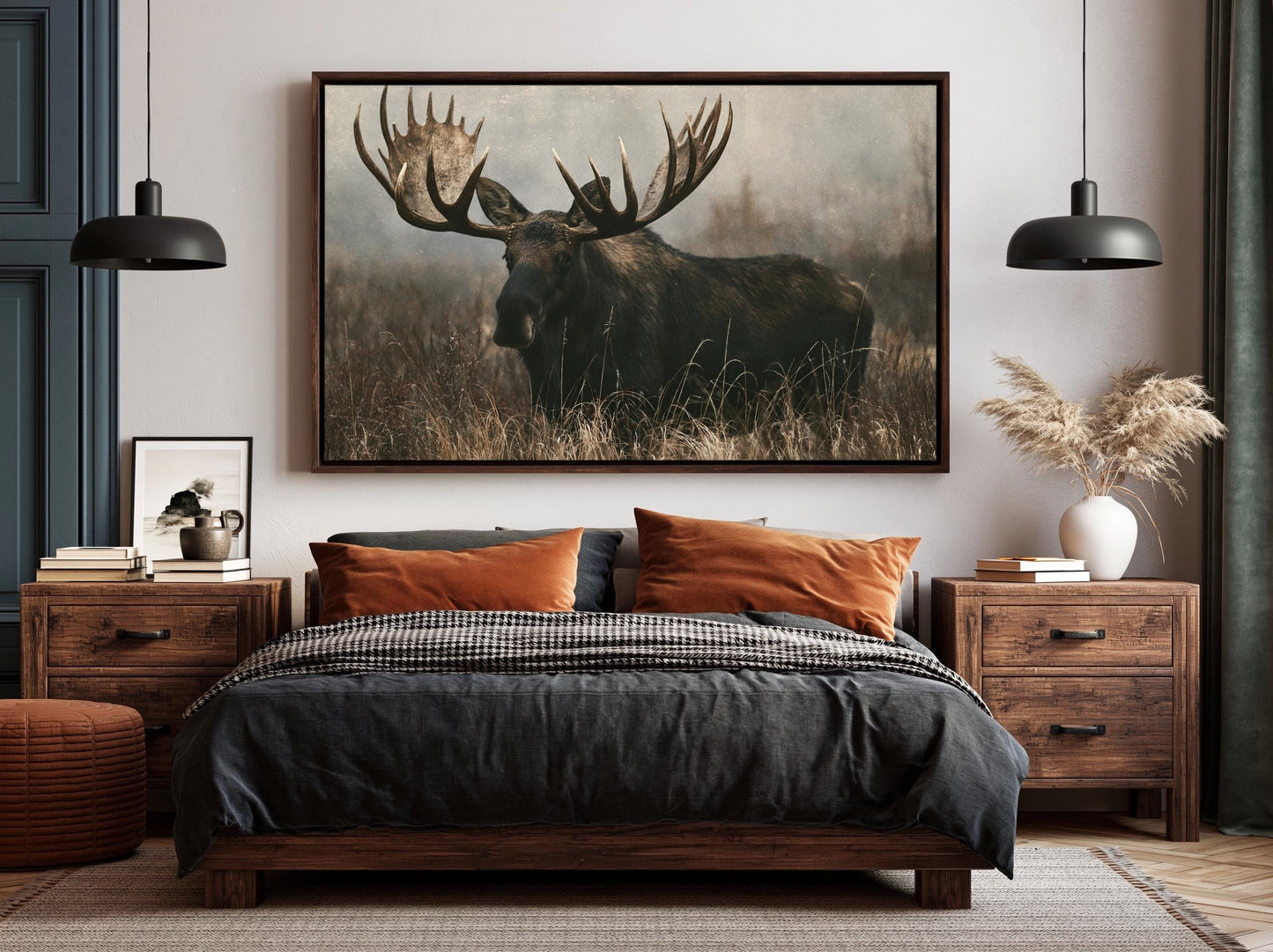 a large framed picture of a moose standing in a grassy field.