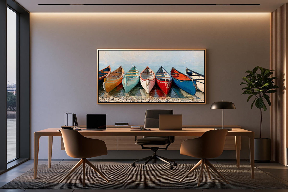 a modern office space with a large painting of colorful boats hanging on the wall above a wooden desk with a laptop, keyboard, and mouse. The desk is positioned in front of a window, and there are two chairs and a potted plant in the room.