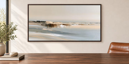 a large landscape painting hanging on a wall above a wooden table.