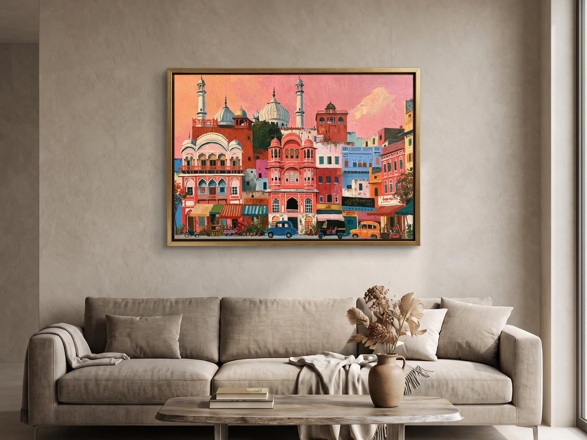 a large, colorful painting of a cityscape hanging on a wall above a beige sofa in a living room.