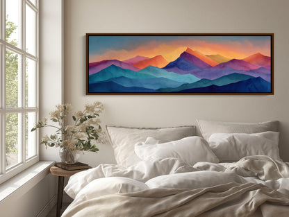 Mountain canvas wall art shown above a bed