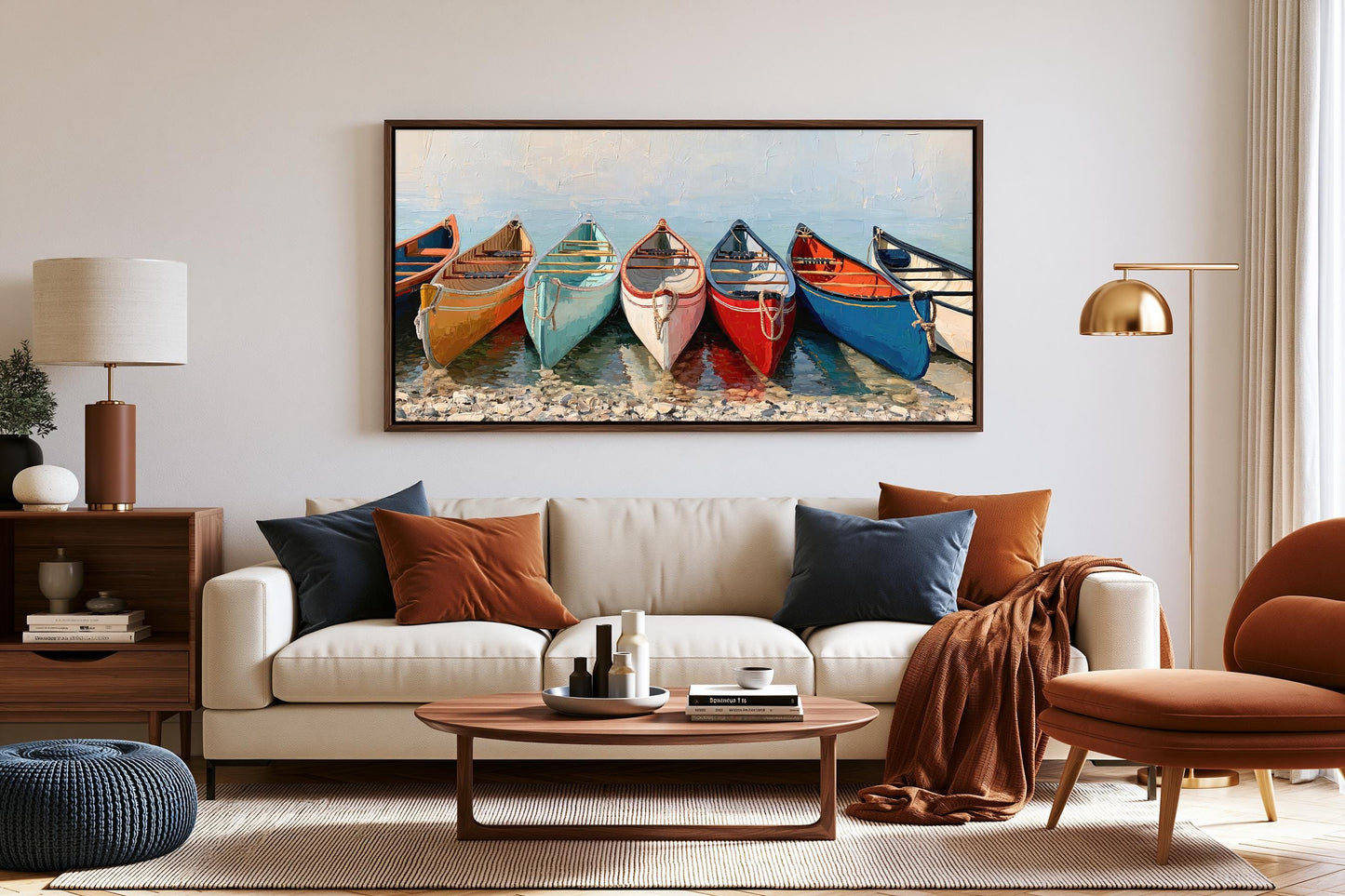 a living room with a large framed painting of colorful boats on the wall above a white sofa. The room has a wooden coffee table, a brown armchair, and a lamp on a side table.