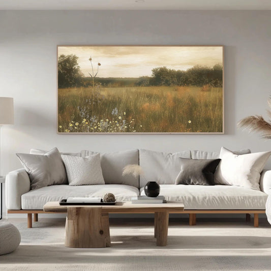 a living room filled with furniture and a painting on the wall