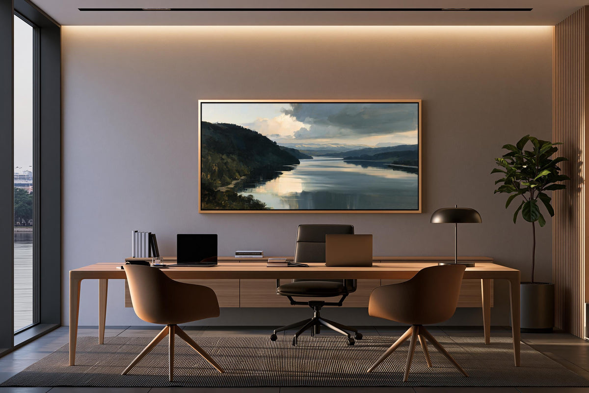 a modern office space with a large window overlooking a scenic landscape. The office features a wooden desk with a laptop, a comfortable chair, and a framed landscape painting on the wall.
