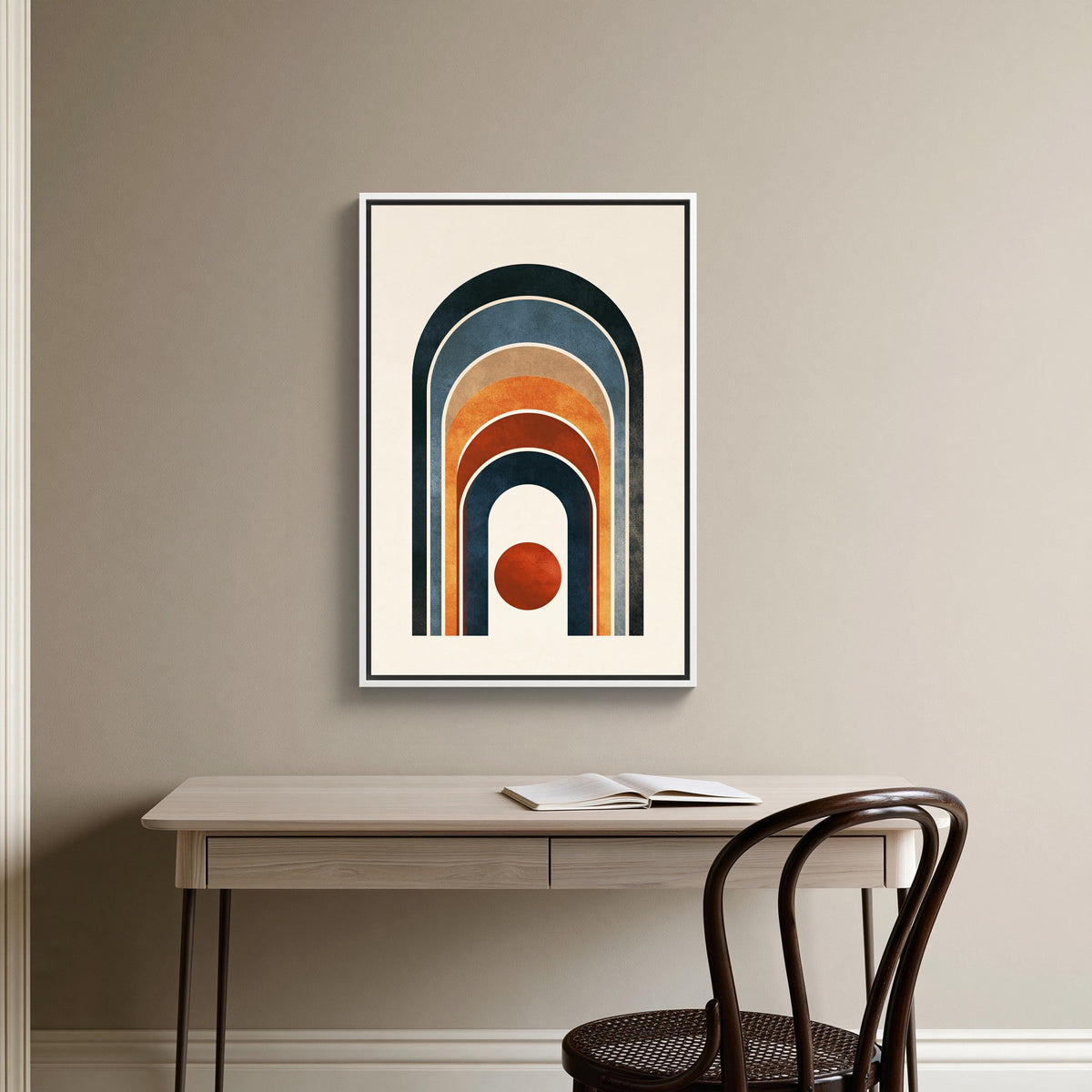 Boho rainbow arch and sun canvas wall art, minimalist workspace with a wooden desk and a chair, and a framed abstract art