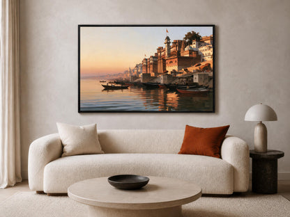 a large, framed painting of a serene waterfront scene with boats and buildings reflected in the water. The painting is hung on a wall above a white sofa with a round coffee table in front of it.