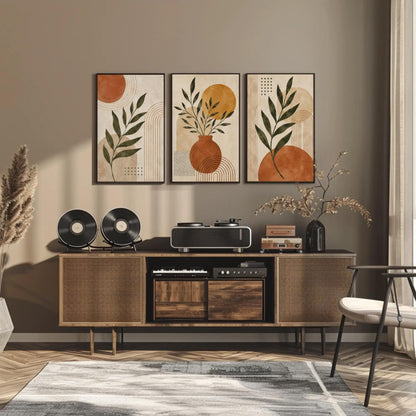 Boho botanical abstract trio canvas wall art, modern living room with a wooden entertainment center, a black speaker, and