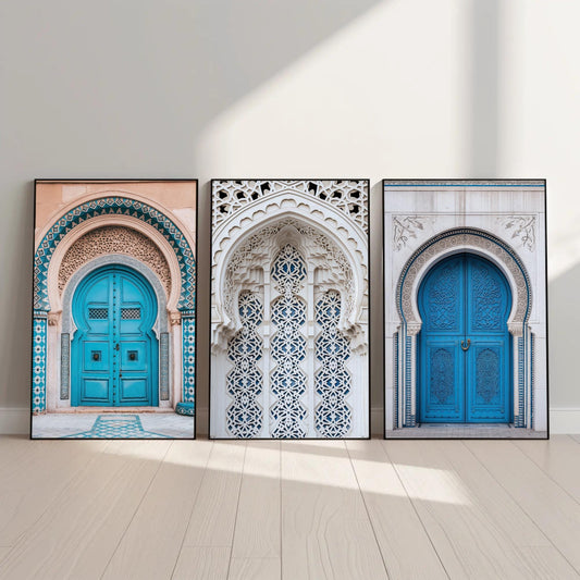 three framed pictures of blue doors on a white wall