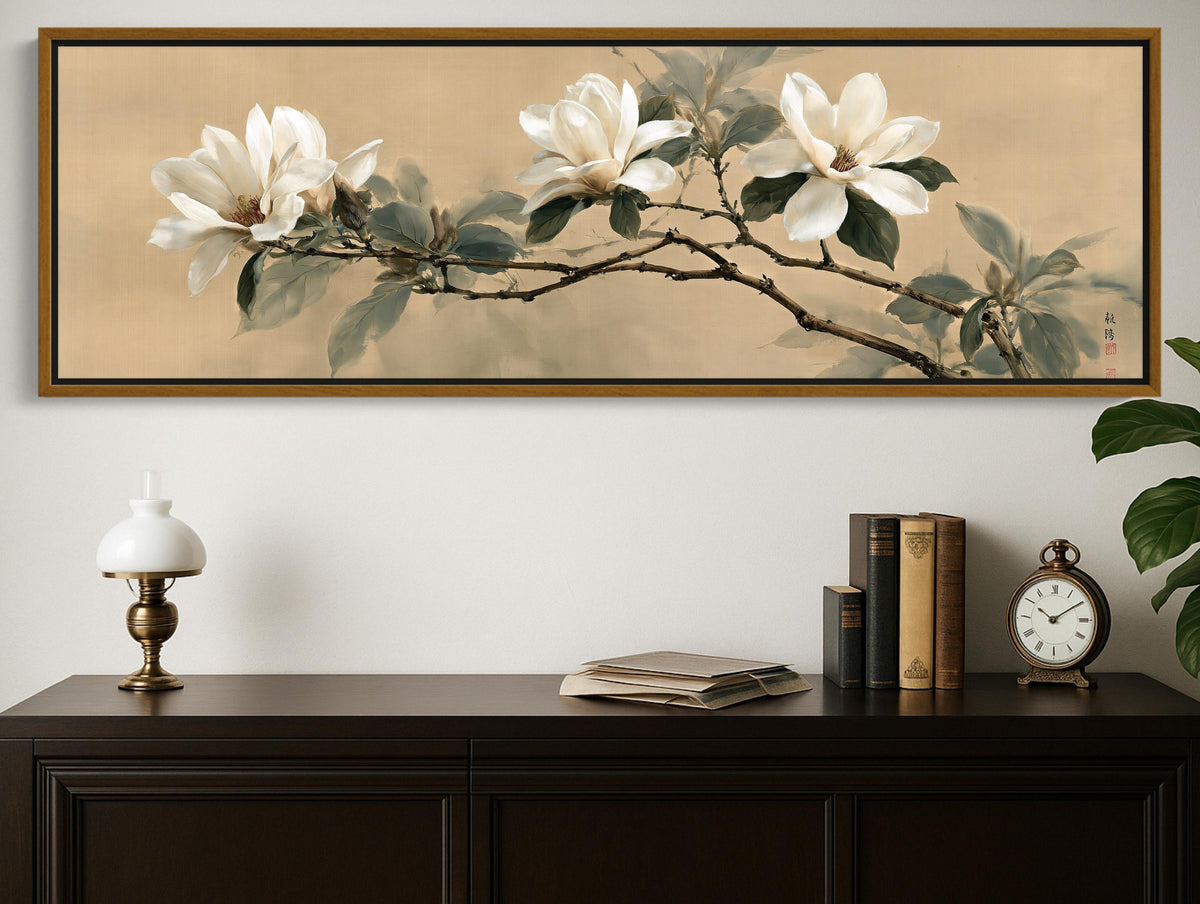 a large painting of white flowers on a wall above a wooden dresser with a lamp, books, and a clock.